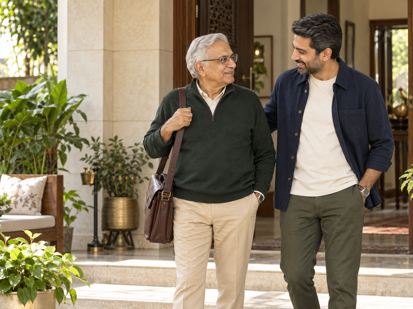 Indian senior father and his adult son stepping out together